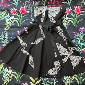 Black dress with white detailed embroidery